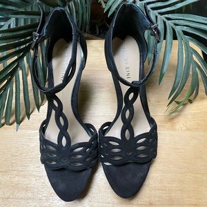 Black suede platform heels.